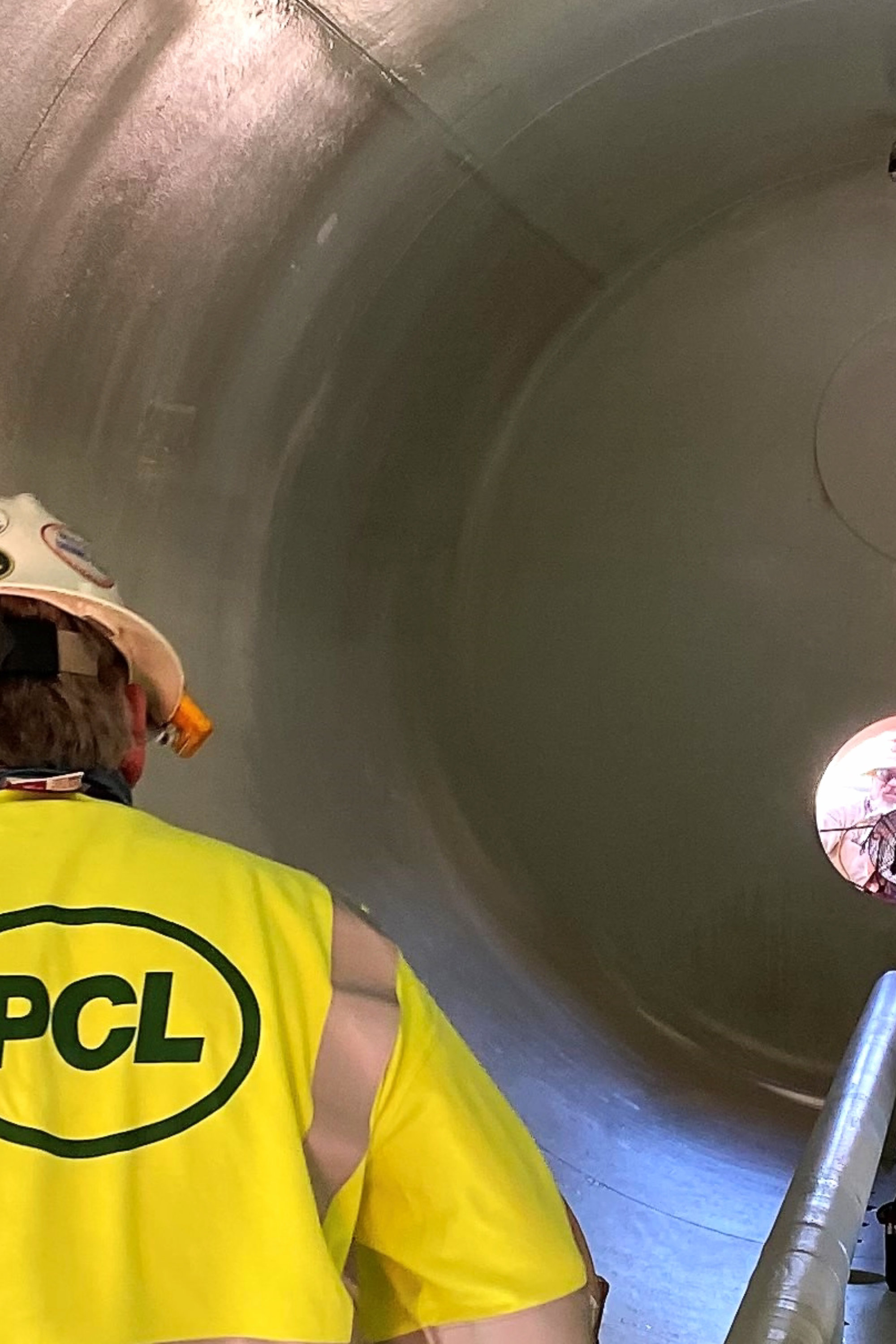 man inspecting pipe