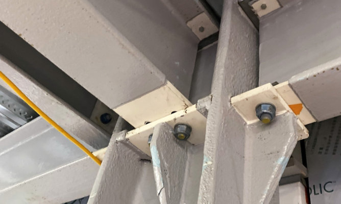 Beam connections needing steel fireproof coatings by Sherwin-Williams Protective & Marine