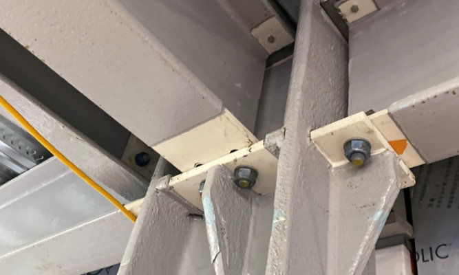 Beam connections needing steel fireproof coatings by Sherwin-Williams Protective & Marine