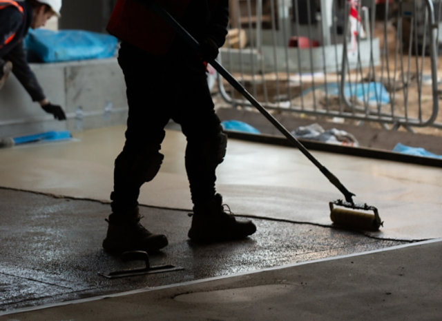 contractor installing brewery flooring