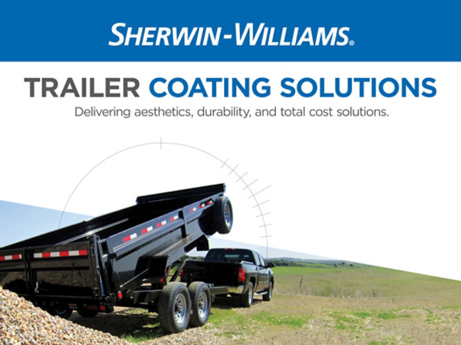 Image of a black trailer in a field outside