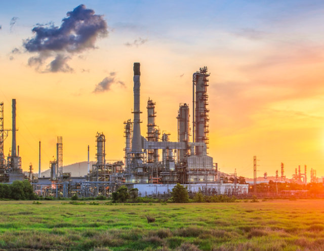 OIl refinery at sunset