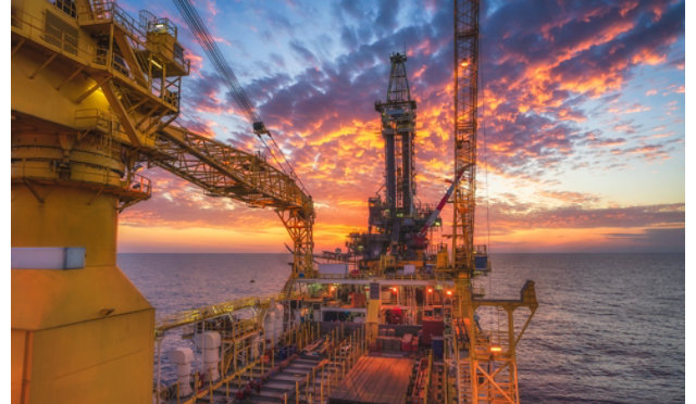 An offshore oil rig at night