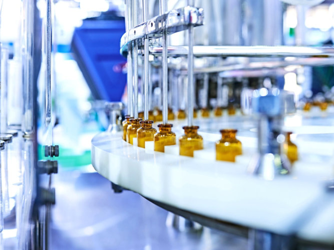 Pharmaceuticals being manufactured in vials
