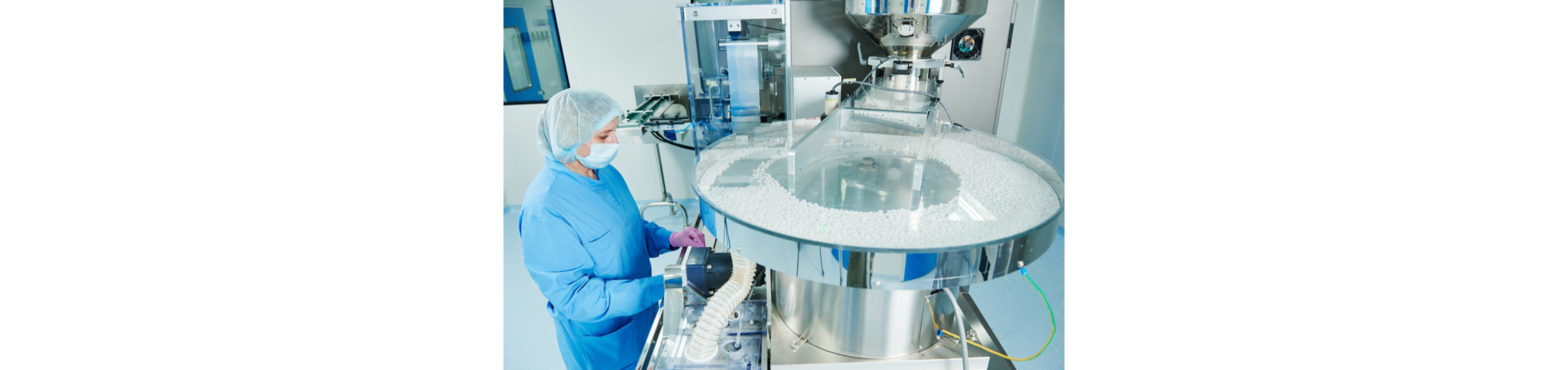 person working in a pharmaceutical facility