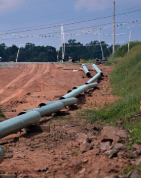 below ground oil and gas pipe waiting to be buried