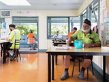 plant workers in lunchroom