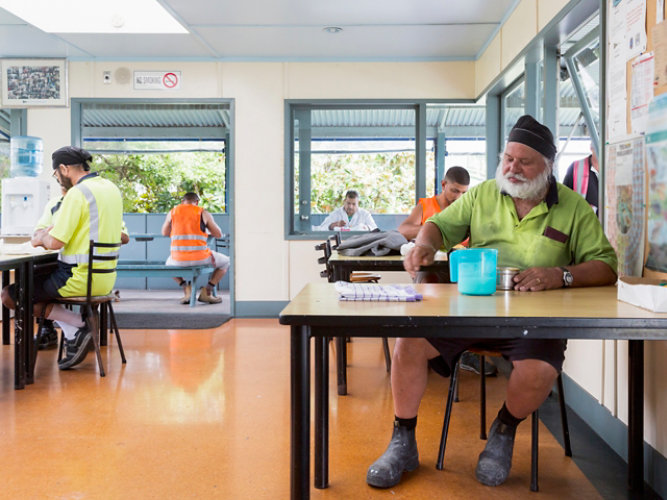 plant workers in lunchroom