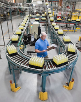 An employee working on a bottle packaging line