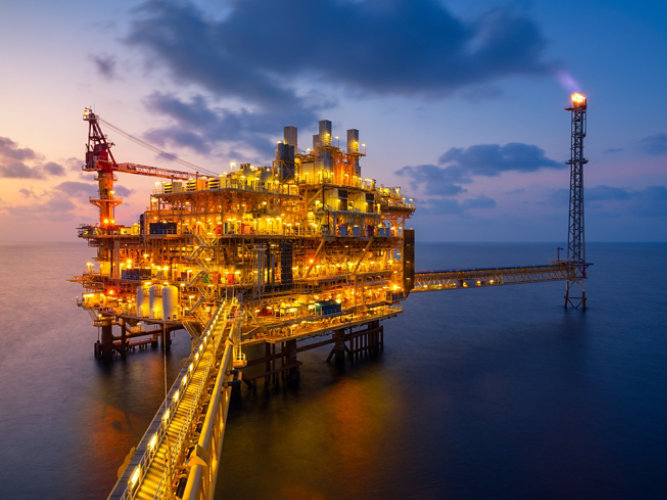 Offshore oil rig at night