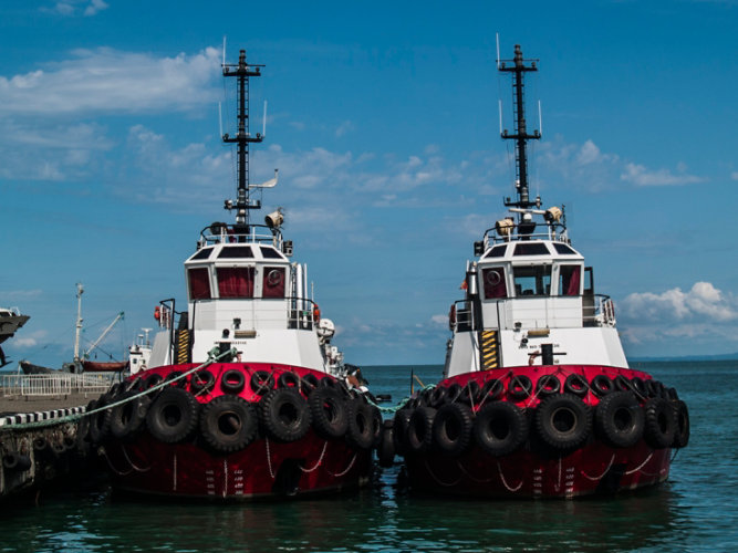two boats next to each other on water