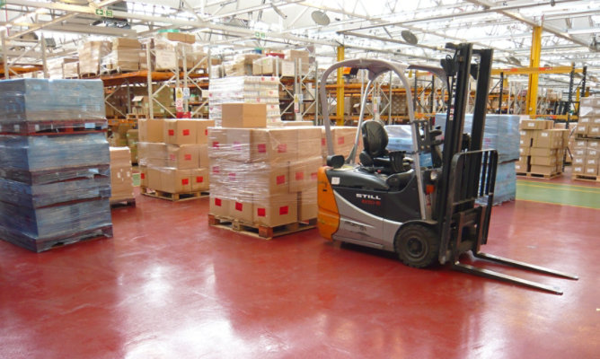 forklift handling cargo in warehouse