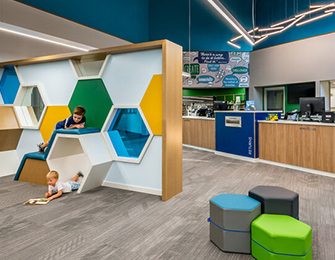 Four Point Design Partners renovated the Indianapolis Public Library Wayne Branch children’s area in Westhighland White SW 7566 (255-C3), Mindful Gray SW 7016 (244-C2), Manitou Blue SW 6501 (174-C5), Indigo SW 6531 (178-C7), and Cilantro SW 6453 (158-C6). Photo by Michael Firsich.