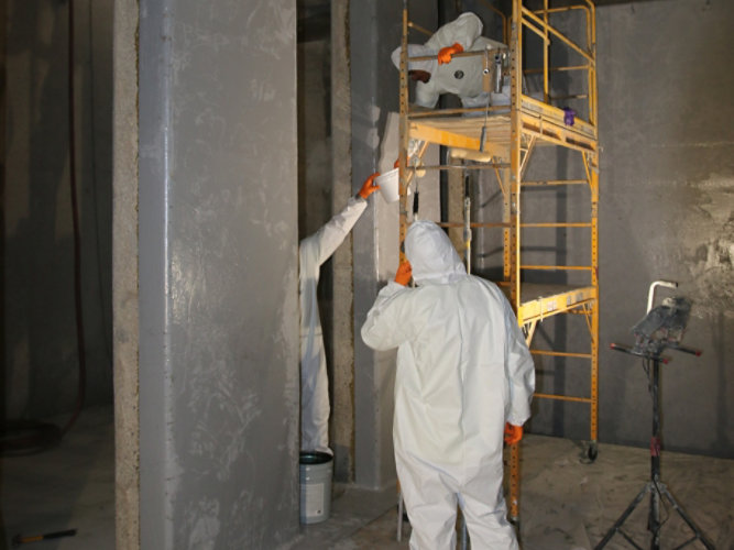 Certified applicators applying coatings. 