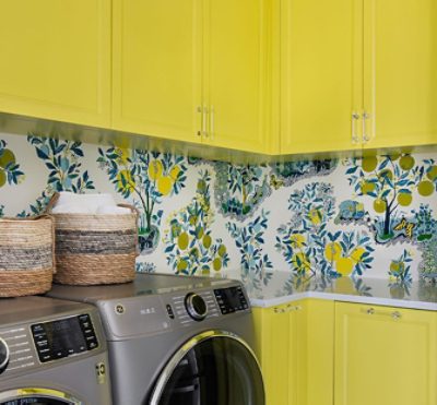 bright yellow cabinets in a laundry room.