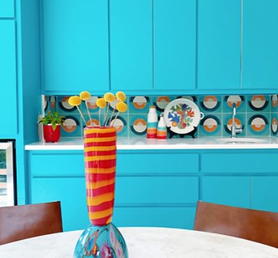 bright blue kitchen cabinets and funky decor.