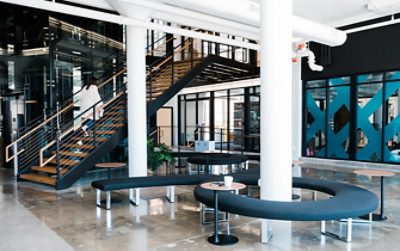 Large open space with benches, tables, and a large staircase.