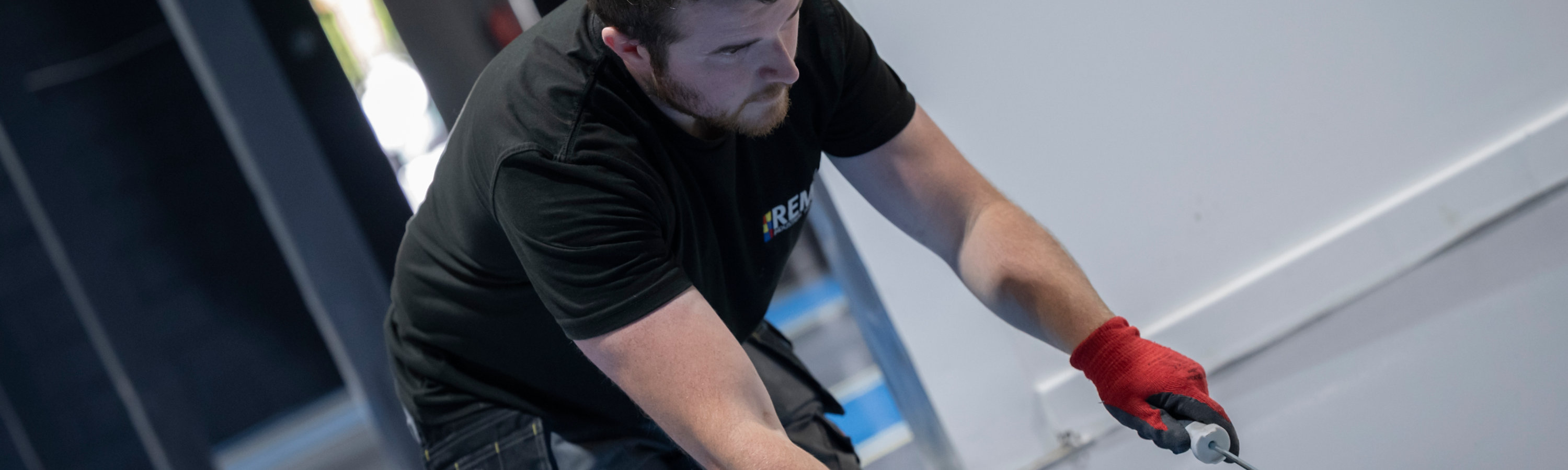 Black line marking is applied using a roller over taped edges