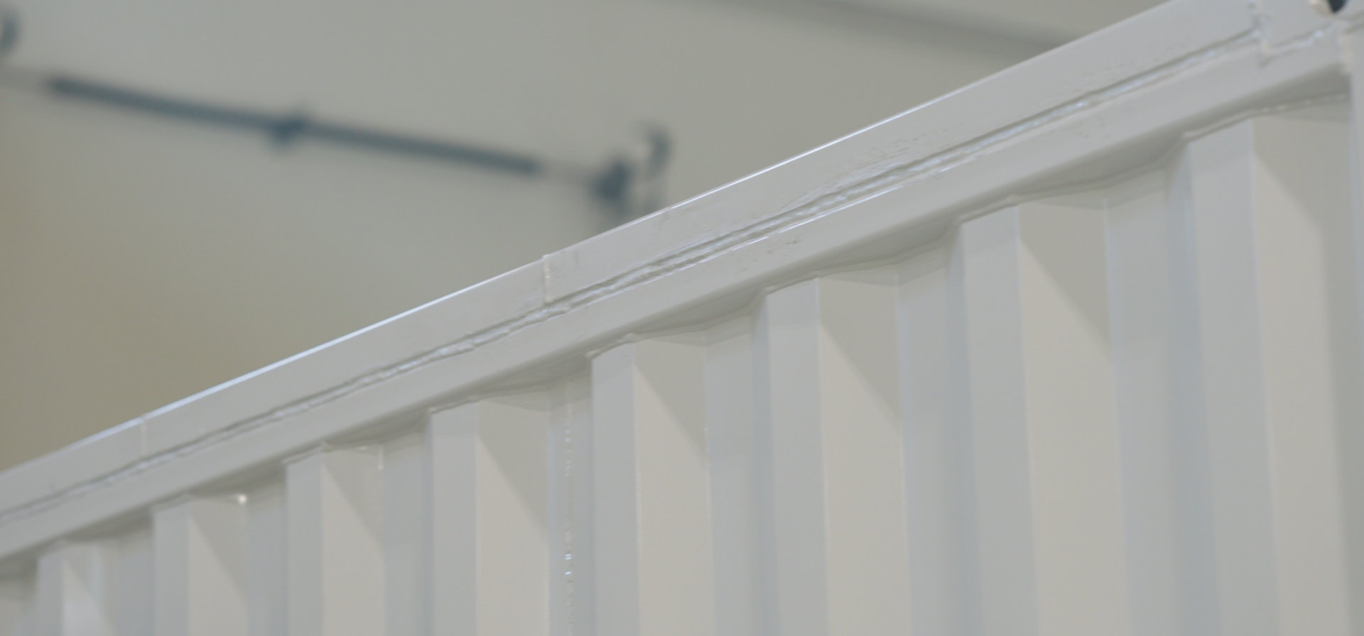 close up of white coating on shipping container
