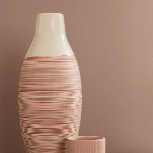 A tall vase in front of an interior wall painted Redend Point SW 9081.