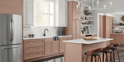 redend point cabinets with some white accents and neutral kitchen decor.