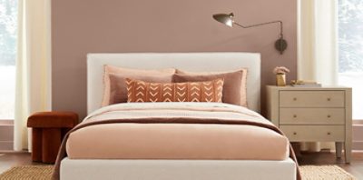 redend point walls in a bedroom with warm neutrals to compliment.