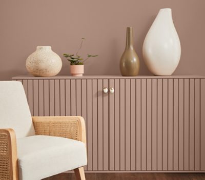 redend point wall and cabinet with neutral decor and chair.