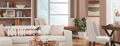 redend point walls with neutral decor and furniture in a living room.