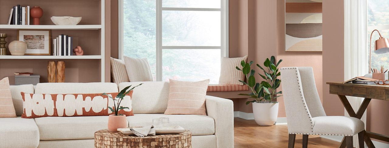 redend point walls with neutral decor and furniture in a living room.