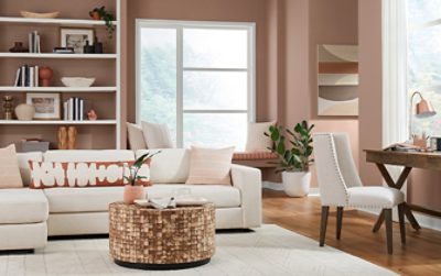 redend point walls with neutral decor and furniture in a living room.