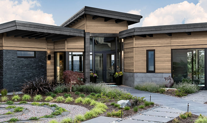 Retouched application image of a modern house featuring Sherwin-Williams Emulate Wood Oak pattern panels in the Wheat colorway 