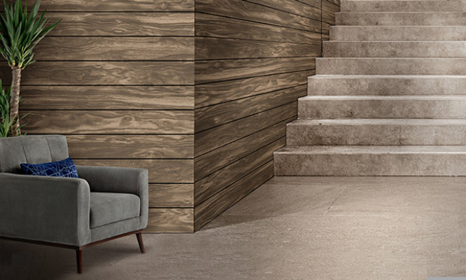 Retouched application image of a staircase featuring Sherwin-Williams Emulate Wood Burl pattern panels in the Truffle colorway 