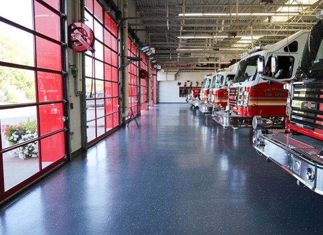 fire trucks in front of firehouse doors