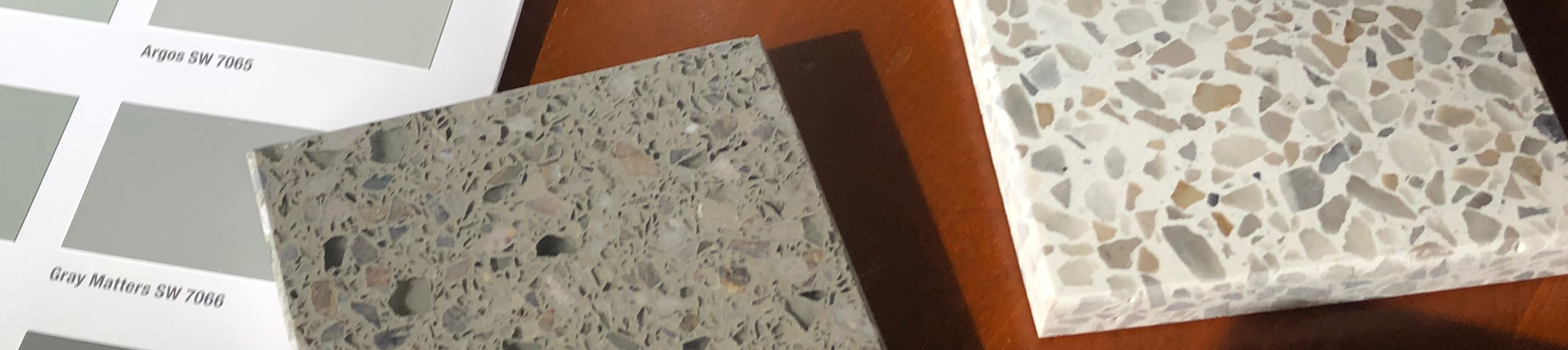 color cards and flooring samples arranged on a desk