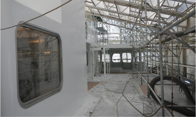 The WSF's M/V Kaleetan's structure in the process of being coated