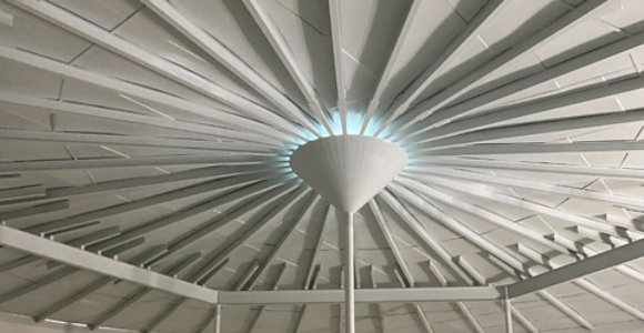 Inside of a water tower with a white potable water coating