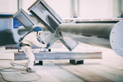 Structural steel getting coated in intumescent passive fire protective coatings.