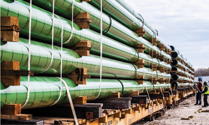 Rack of oil &amp; petrol pipes loaded on a rail car