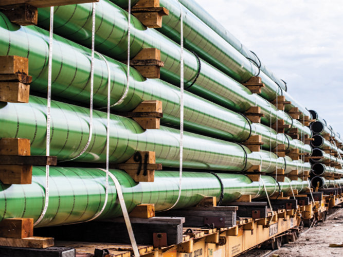 Rack of underground pipe stacked on a rail car