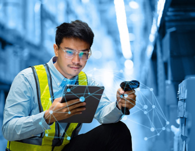 Person taking inventory with a tablet and scanner