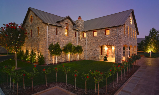 Angled view of Silver Oak Wine Cellar's building at night