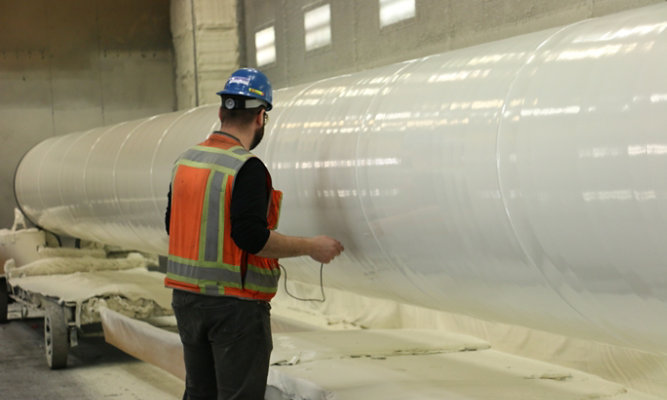 Inspectors holiday testing the transmission pipes