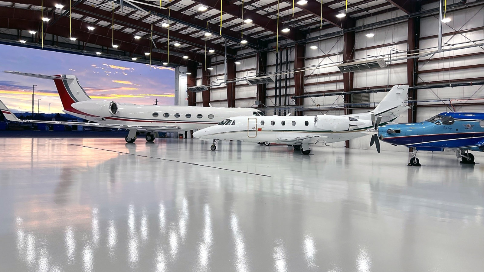 Western Aviation hangar with aircraft positioned on durable coated floor