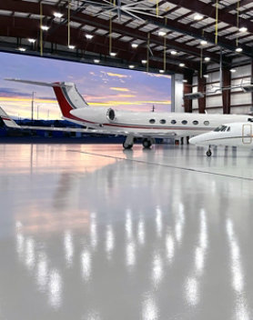 Busy hangar with protective resinous flooring