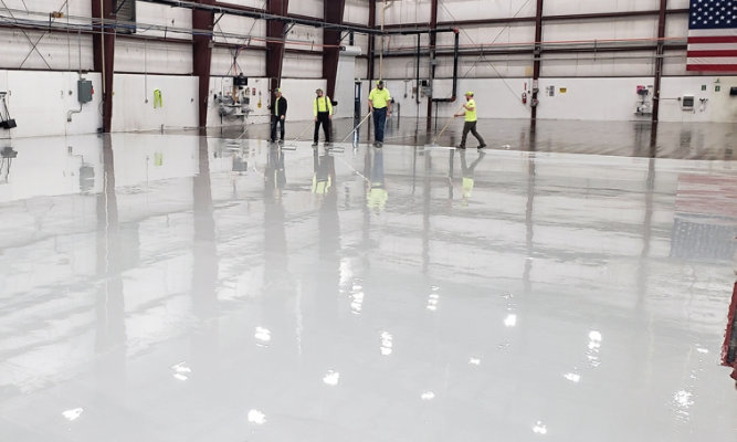 expert-crew-installing-hangar-flooring