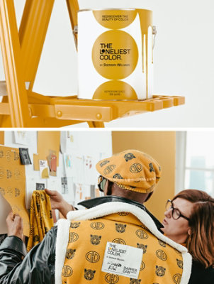 Closeup of paint can on a step ladder with The Loneliest Color logo on the label. Sue Wadden and Dapper Dan looking at fabric swatches on a moodboard.