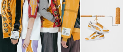 Studio photo of four models, shown from shoulder to knee, all wearing pieces of wearable art from Dapper Dan’s custom The Loneliest Color collection. Custom-designed white sneakers with Kingdom Gold details hanging by the shoelaces from a horizontal paint roller.