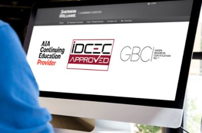 A large desktop computer monitor displaying Sherwin-Williams CEU page.