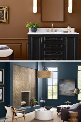 First image: Bathroom vanity with black cabinet, white marble countertop, gold details and modern oblong vertical lights in front of light brown wall with wainscoting. Second image: Living room with deep blue walls, statement fireplace focal point, tall windows and modern traditional style decor. 