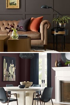 First image: Sitting room with tufted taupe velvet round-armed sofa, black side table and antique-style desk lamp, split-cylinder metallic coffee table, faux animal-hide rug and grid pattern board-and-batten wall painted deep brown. Second image: Dining area with dark purple walls with white French doors framed by navy curtains, black dining chairs and white table under black pendant light, faux zebra-hide rug in front of white fireplace.